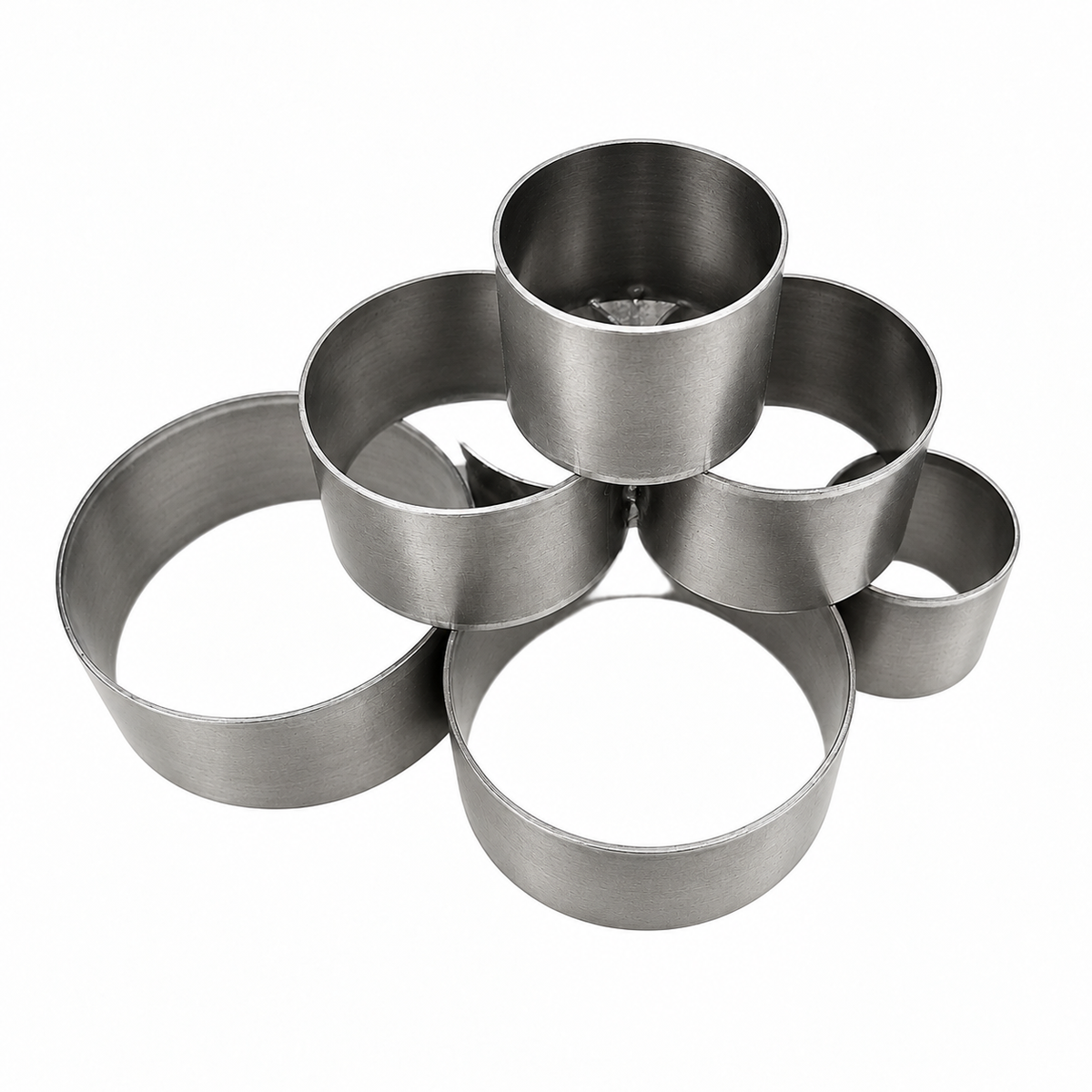 Round steel leather clicker cutting dies arranged together on a white background