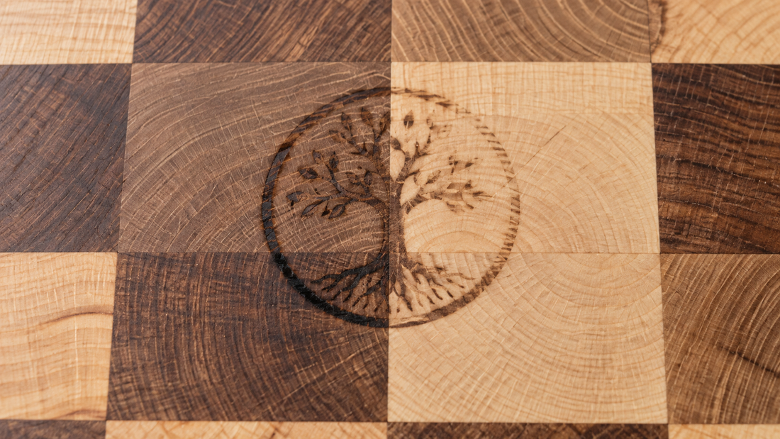 Illustrative photo of a blotchy heat-branded logo across end-grain cutting board blocks