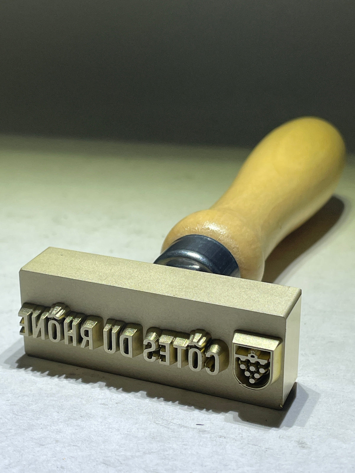 Actual custom metal Côtes du Rhône pottery stamp with wooden handle